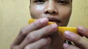 Challenge to drink orange juice with candy
