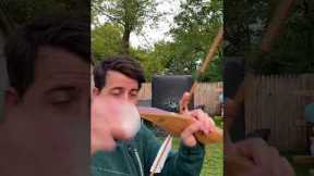 Man Shoots Aerial Targets With Bow | People Are Awesome