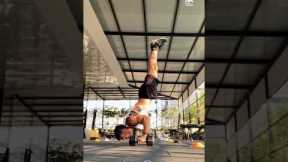 Guy Does Handstand Push-up While Balancing on Dumbbells