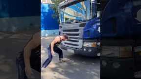Guy Pushes Truck With One Hand