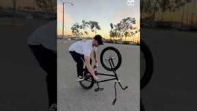 Guy Pedals With Hands While Riding Upside Down on Bike